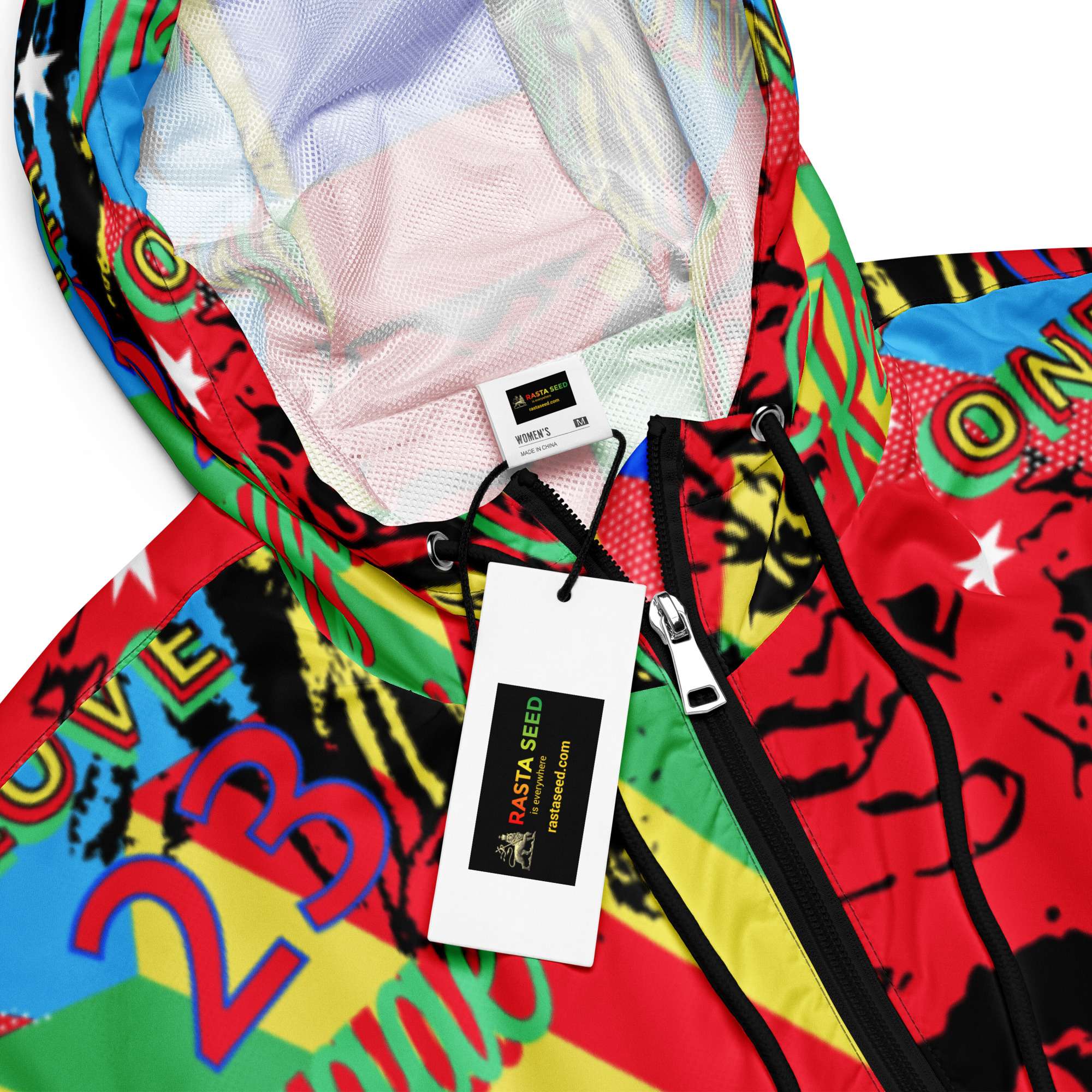 One Love Reggae Women’s cropped windbreaker zoom view in a vivid colourful design. Rastaseed original design on merchandise and clothing.