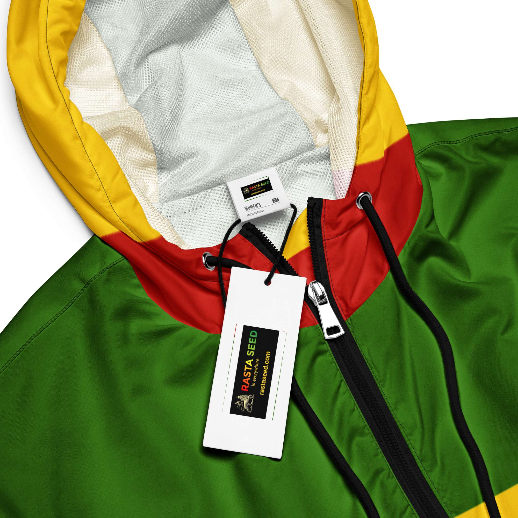 Rasta Women’s cropped windbreaker in red gold and green close up view. Funky rain coat that is great for festivals. Rastaseed online merchandise.