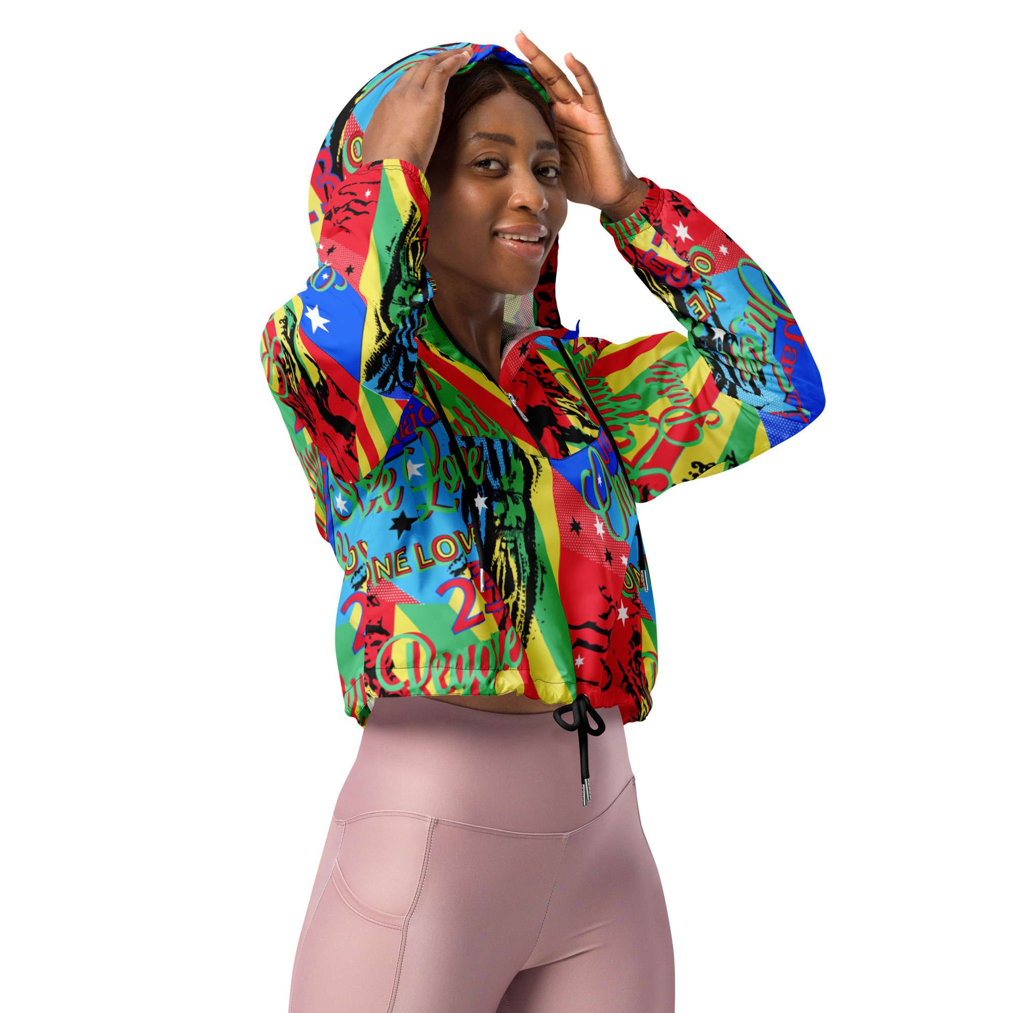 One Love Reggae Women’s cropped windbreaker front right in a vivid colourful design. Rastaseed original design on merchandise and clothing.