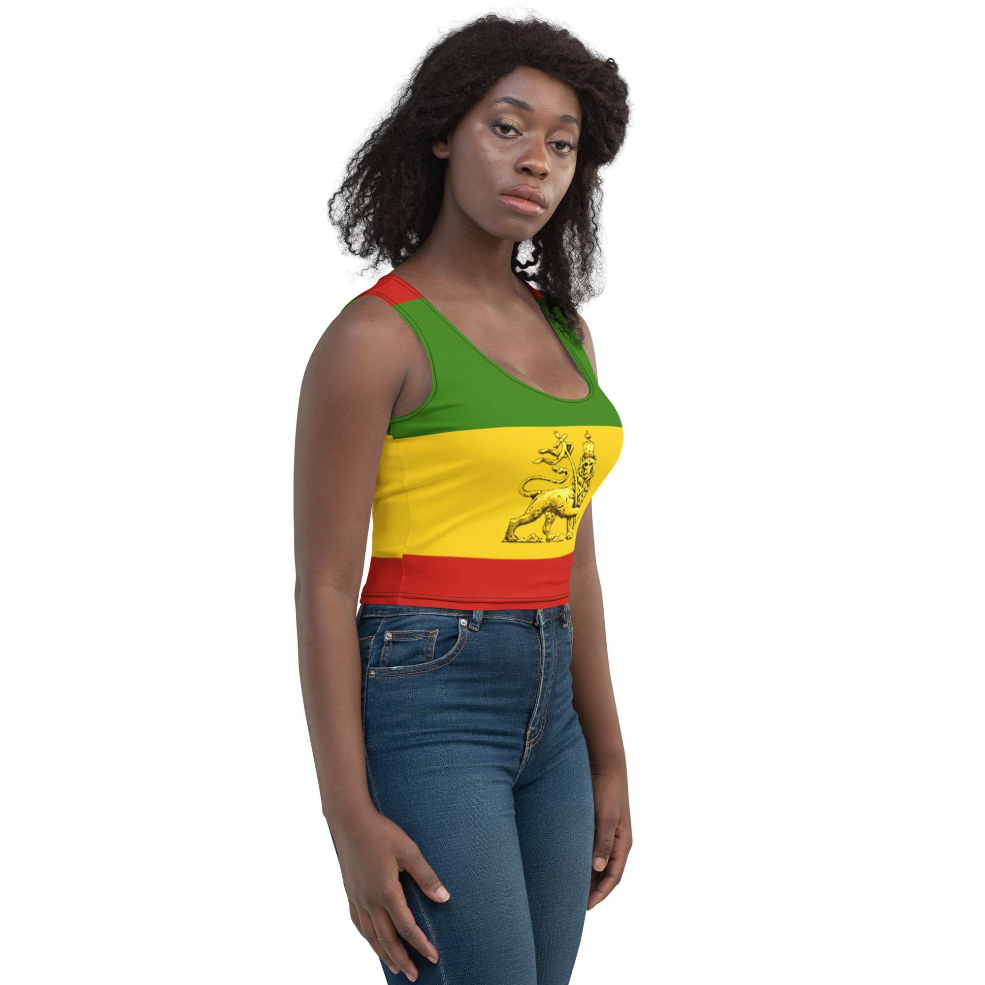 Conquering Lion of Judah Crop Top female model right side front view in red gold and green four way stretch comfortable microfibre fabric. Rastaseed Rastafarian merchandise.