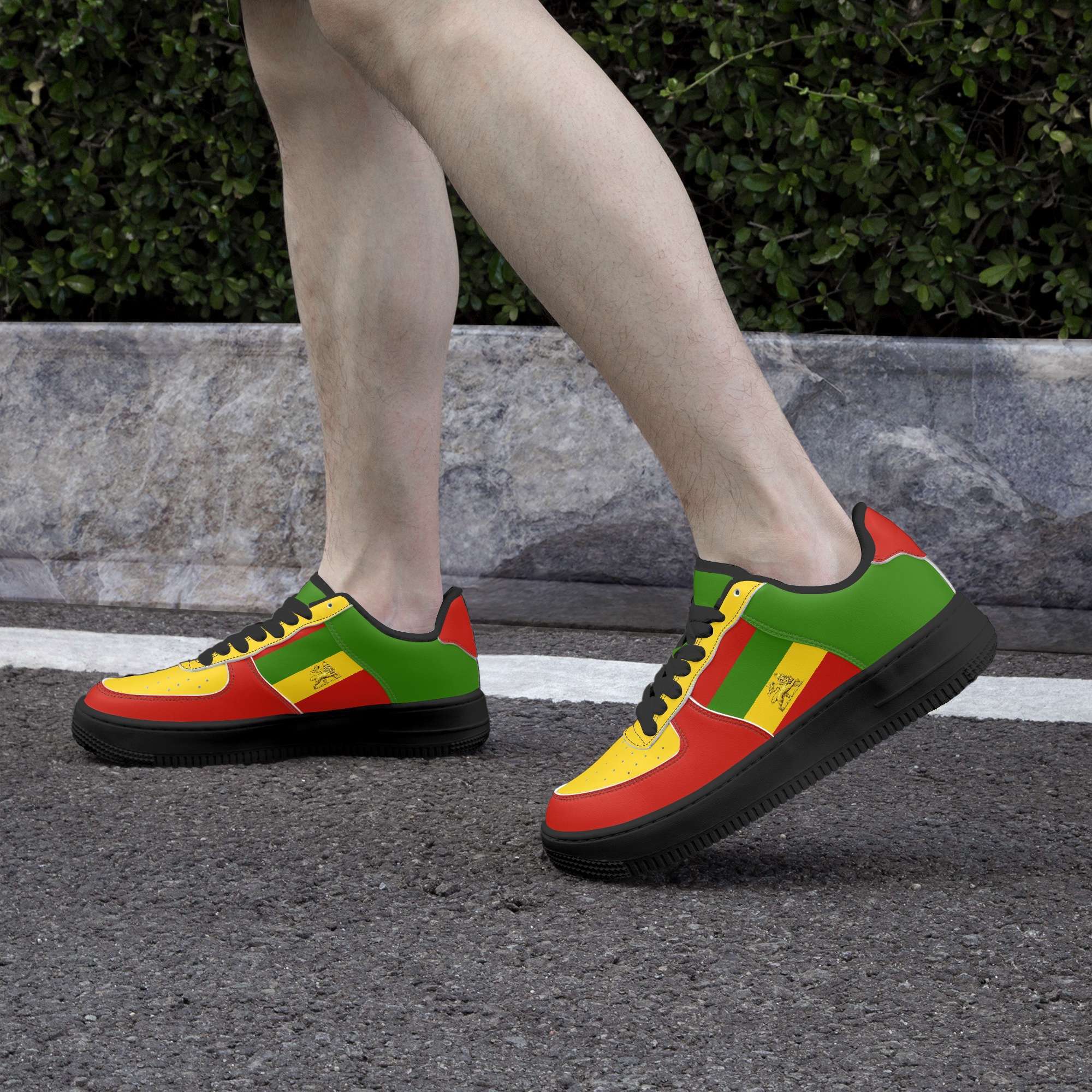 Rastafarian shoes in red gold and green. Sneakers with thick black sole pair model side view black trim. Durable and colorful. Rastaseed Brand of merchandise and clothing.