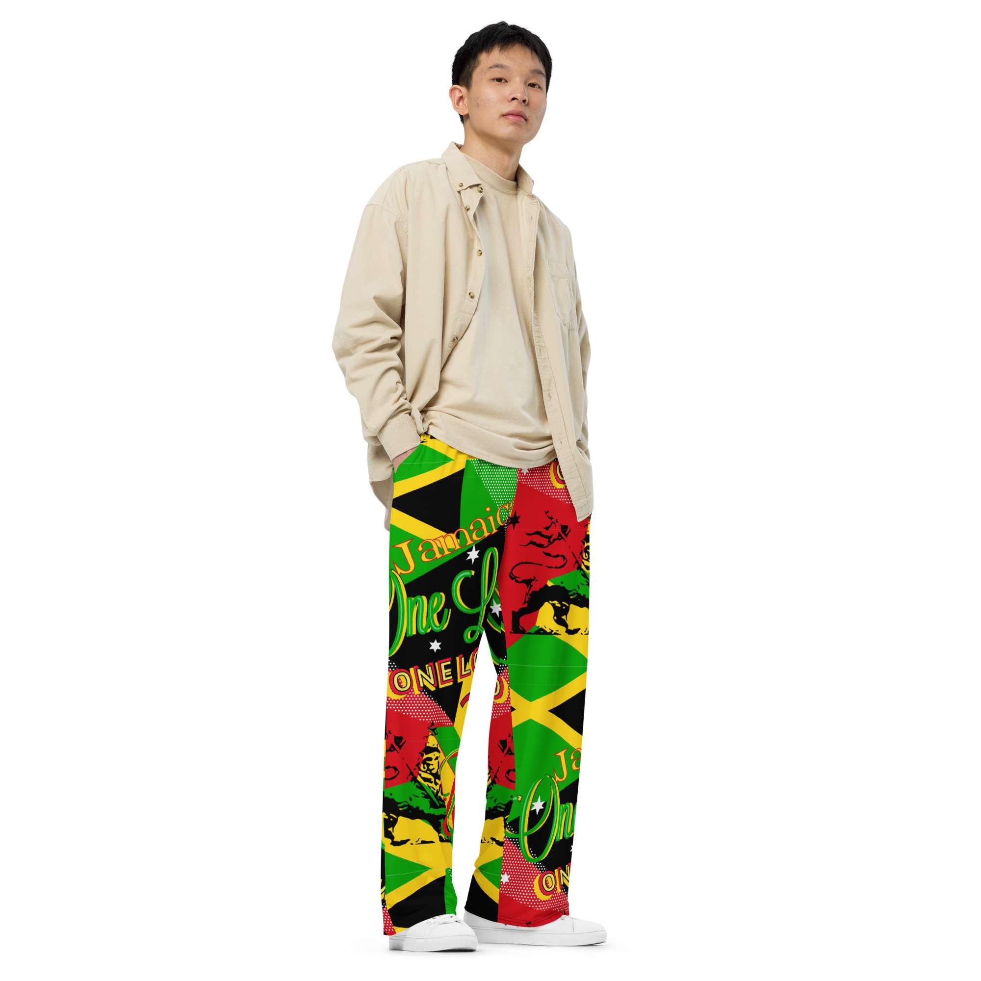 Rasta Reggae Party Wide Leg Pants side male model view in Jamaican and Rastafarian pattern featuring Reggae colors and One Love. Rastaseed brand merchandise.