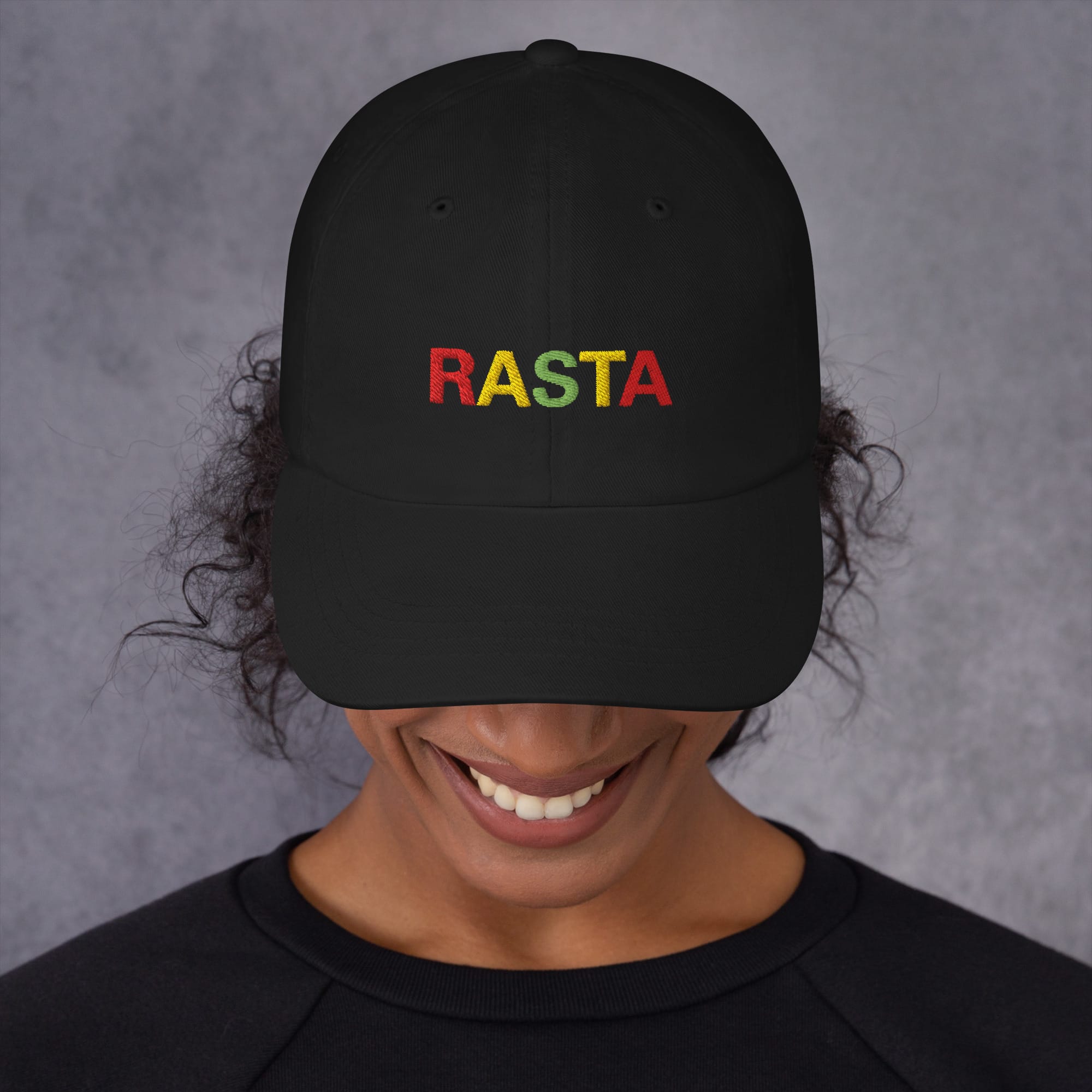 Rasta Cap in dad hat style front view and available in khaki camouflage or black with red gold and green embroidered letters. Original Rasta gear at Rastaseed shop. Front black model view