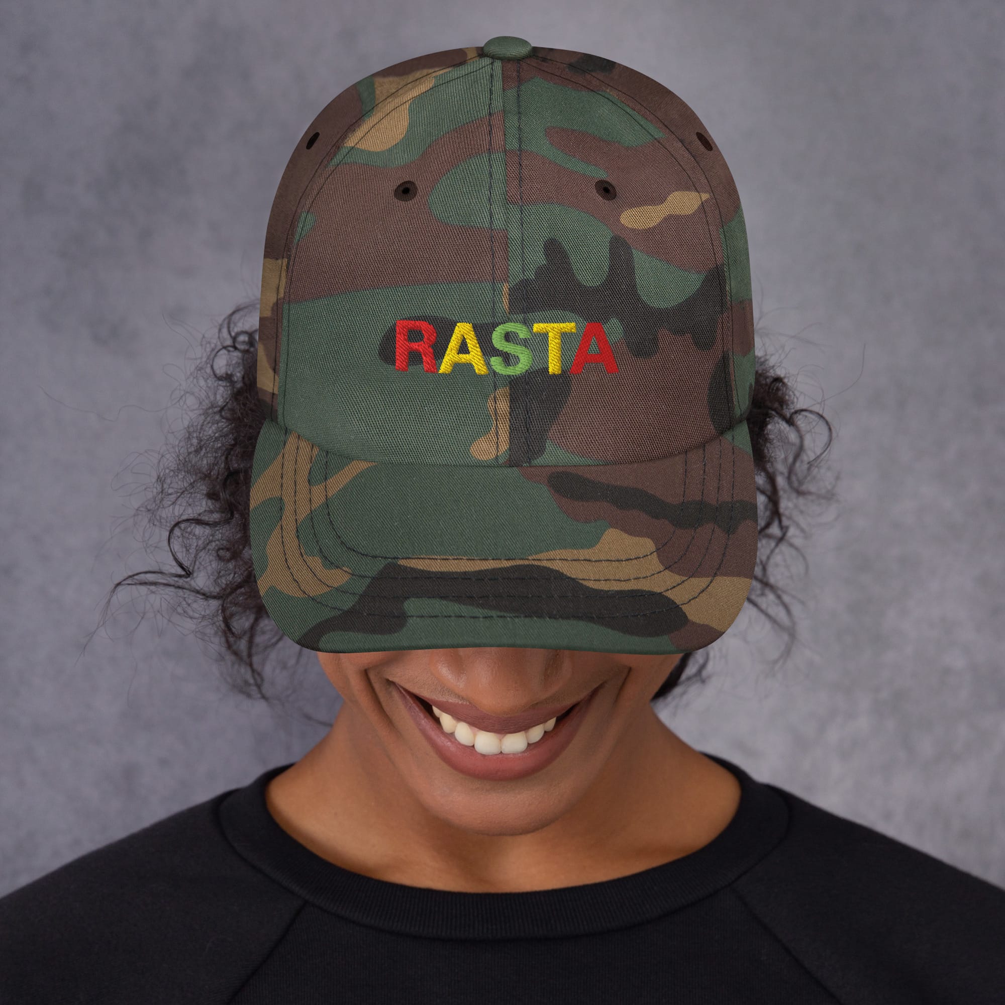 Rasta Cap in dad hat style front view and available in khaki camouflage or black with red gold and green embroidered letters. Original Rasta gear at Rastaseed shop. Front camo model view
